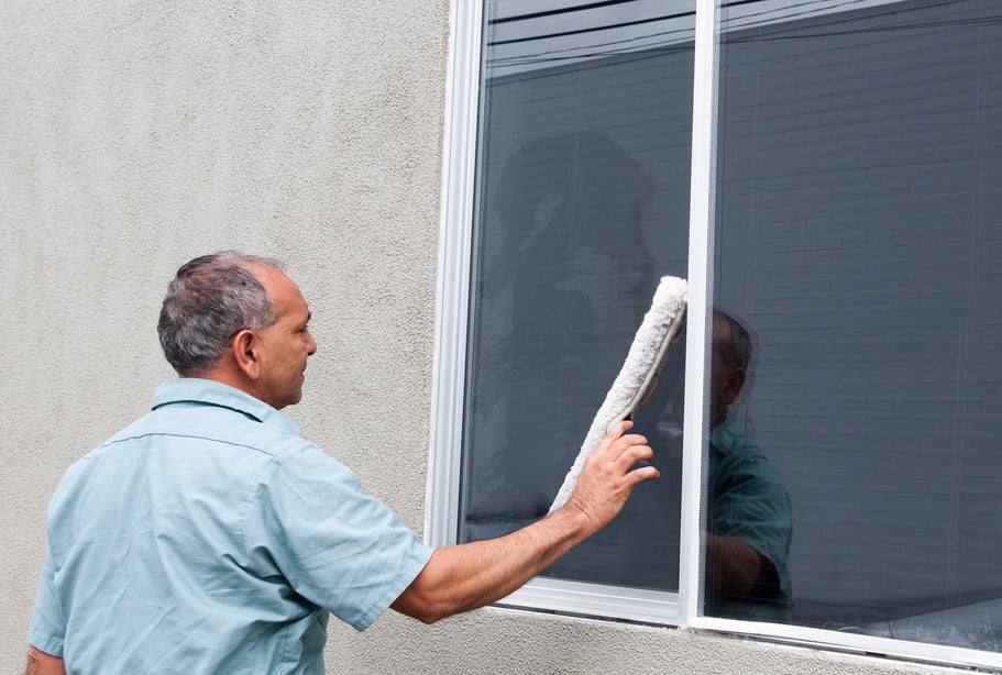 Man Cleaning A Window - Janitorial Services Series